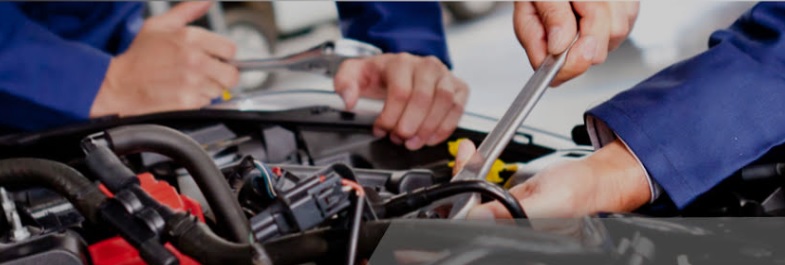 Servicing & repairs – technicians working in engine bay
